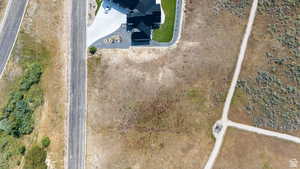 Expansive land parcel featuring open terrain and adjacent roadways