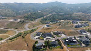 Aerial perspective showcasing a residential development carved into a mountainous landscape