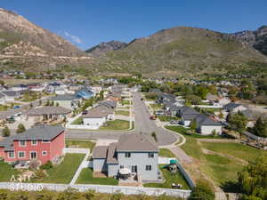 Residential neighborhood featuring a variety of single-family homes with mountain scenery in the background
