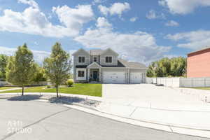 Contemporary residential property featuring light grey siding and white trim