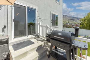Outdoor patio with concrete steps and white railing