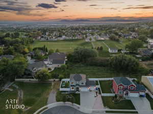 Aerial perspective showcasing a residential neighborhood with distant mountains