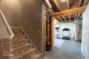 Staircase featuring wood-finish treads and white risers