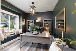 Accent wall with deep green paint and wood-finish flooring