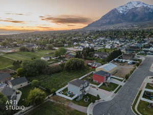 Elevated aerial perspective showcasing a residential neighborhood with mountain backdrop