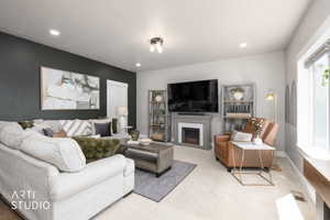 Living area with recessed lighting and a ceiling-mounted fixture