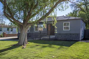 Contemporary charcoal exterior with a stone veneer foundation