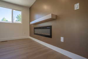 Integrated electric fireplace with a floating mantel shelf