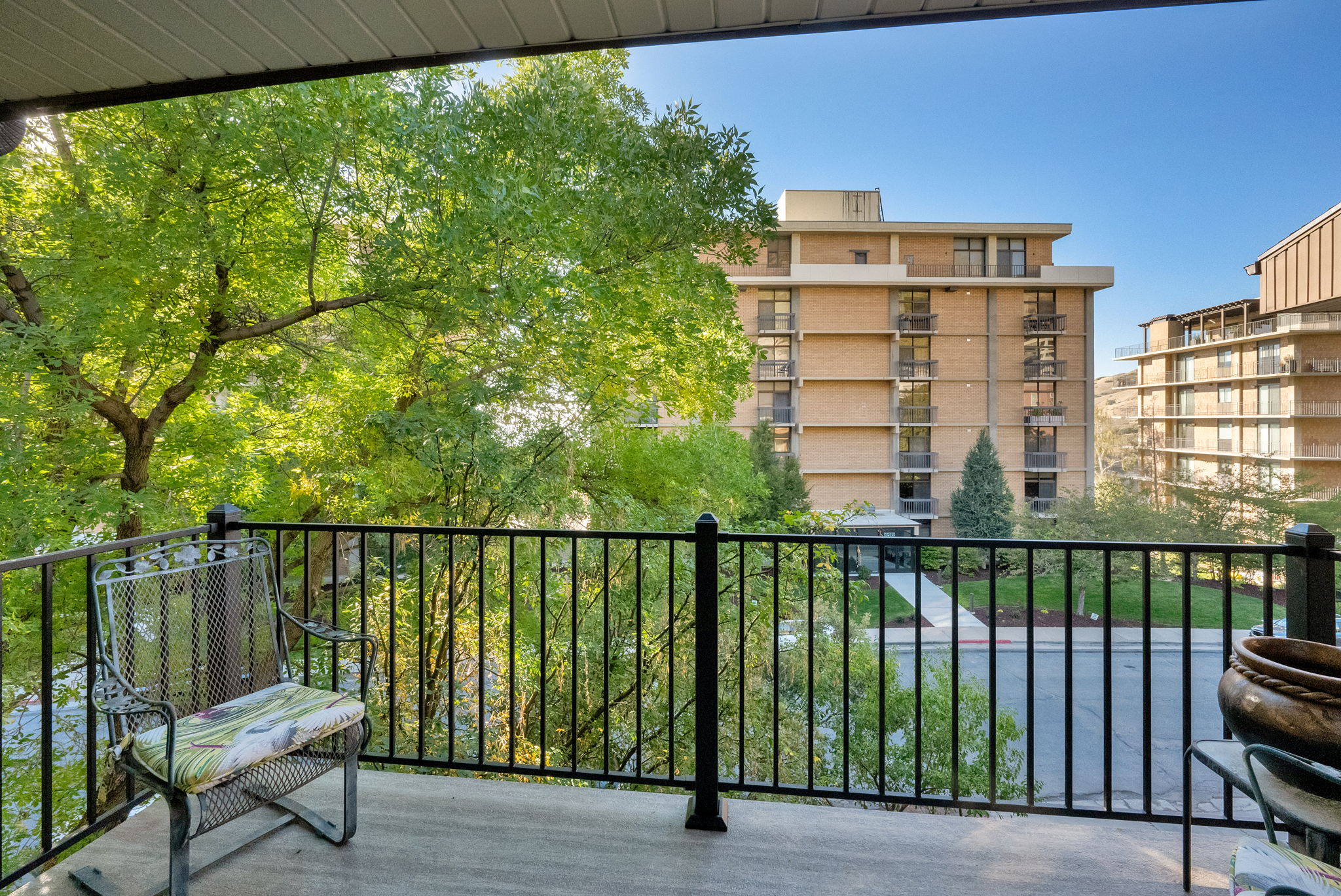 Private balcony with black metal railing