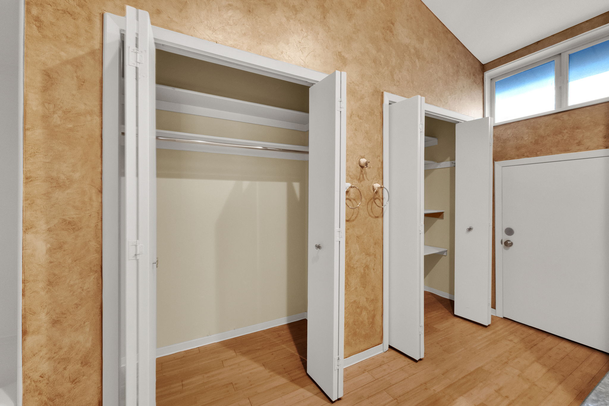 Multiple bi-fold door closets providing ample storage