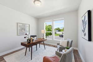 Office at the front of the home offers incredible mountain views and overlooks the green space across the street