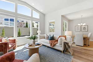 Living area with high ceilings and expansive windows and gas fireplace