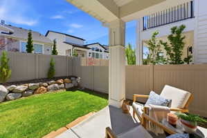 Covered back patio overlooking back yard