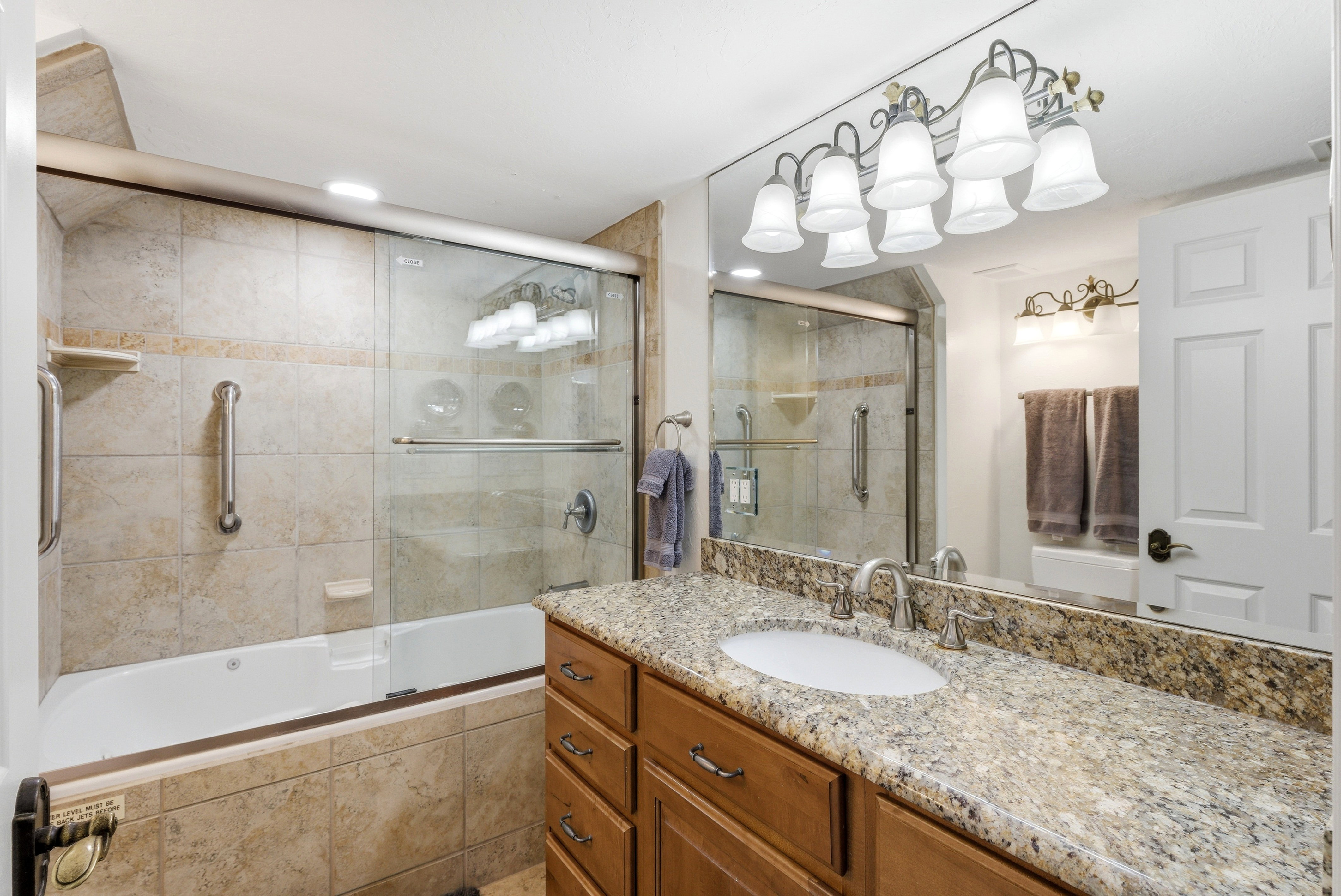 Full bathroom featuring vanity and tiled shower / bath combo