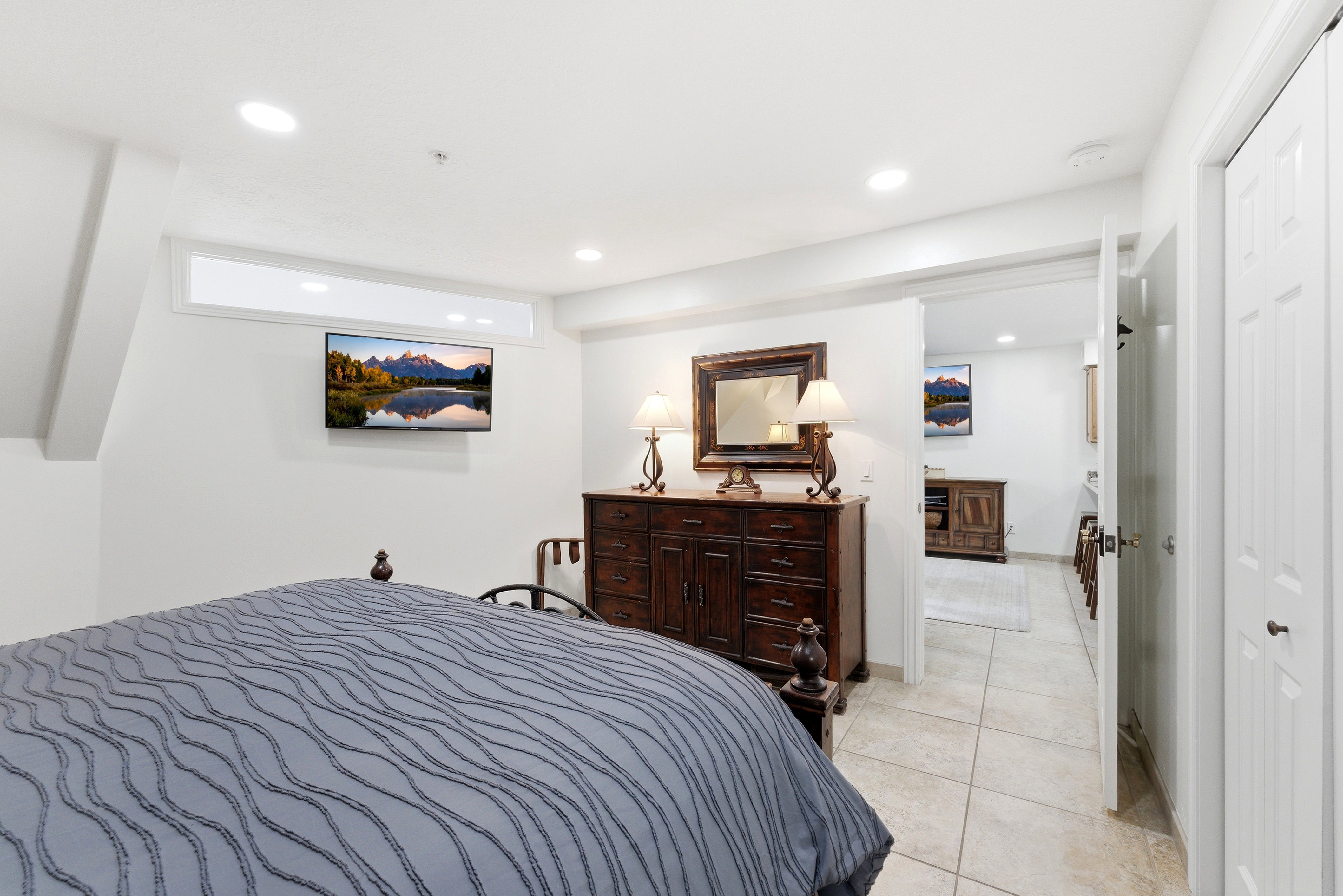 Bedroom with recessed lighting and light tile patterned flooring