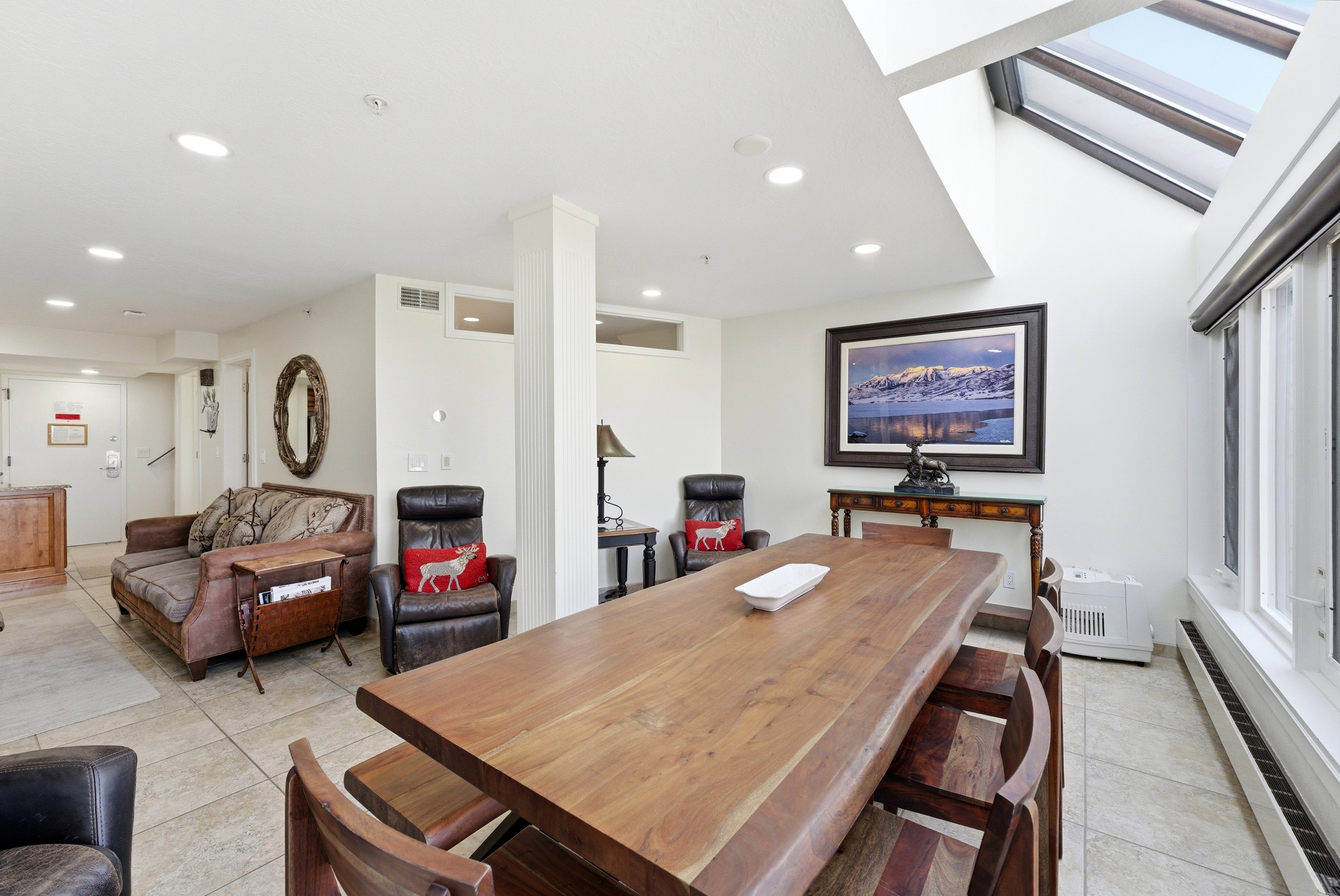 Dining space featuring a baseboard heating unit, light tile patterned floors, and recessed lighting
