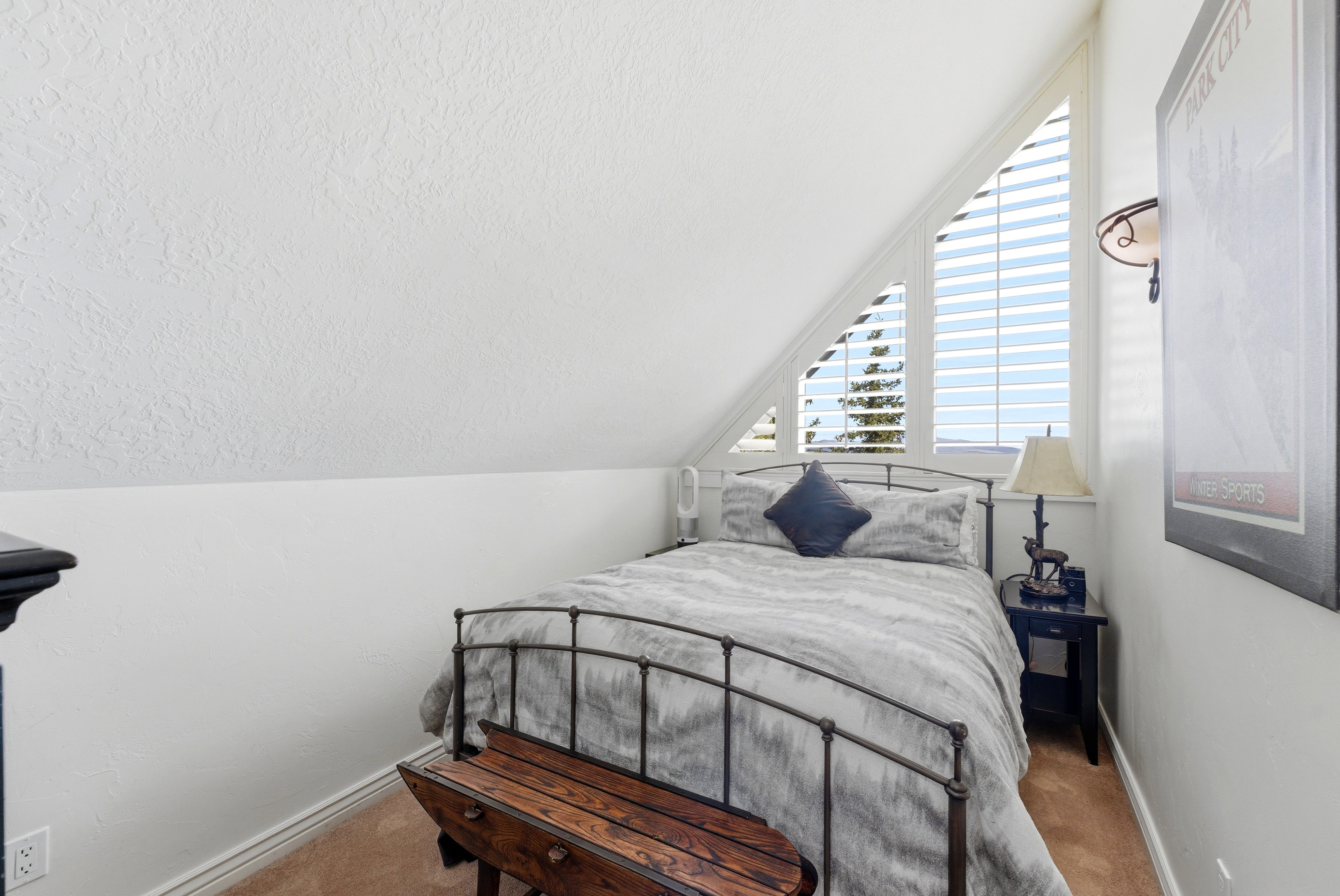 Carpeted bedroom featuring baseboards