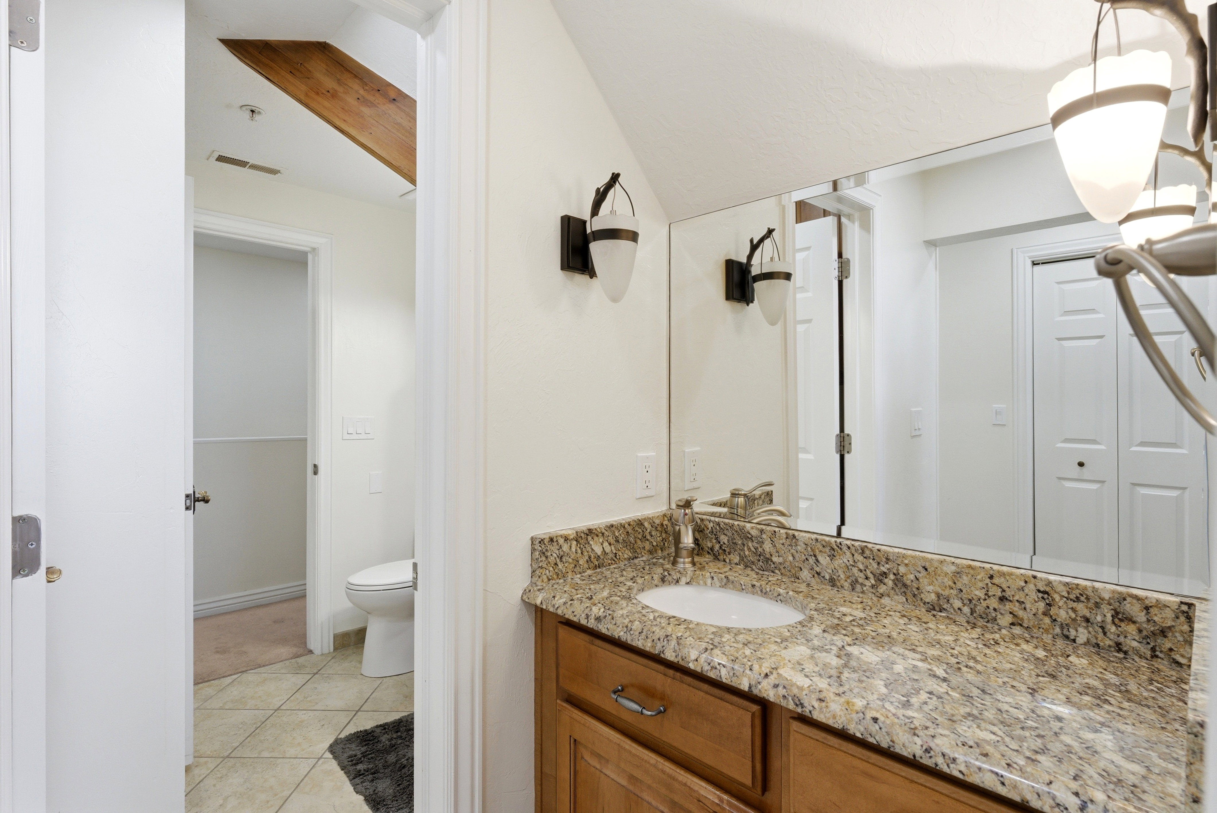 Bathroom with vanity and light tile patterned floors