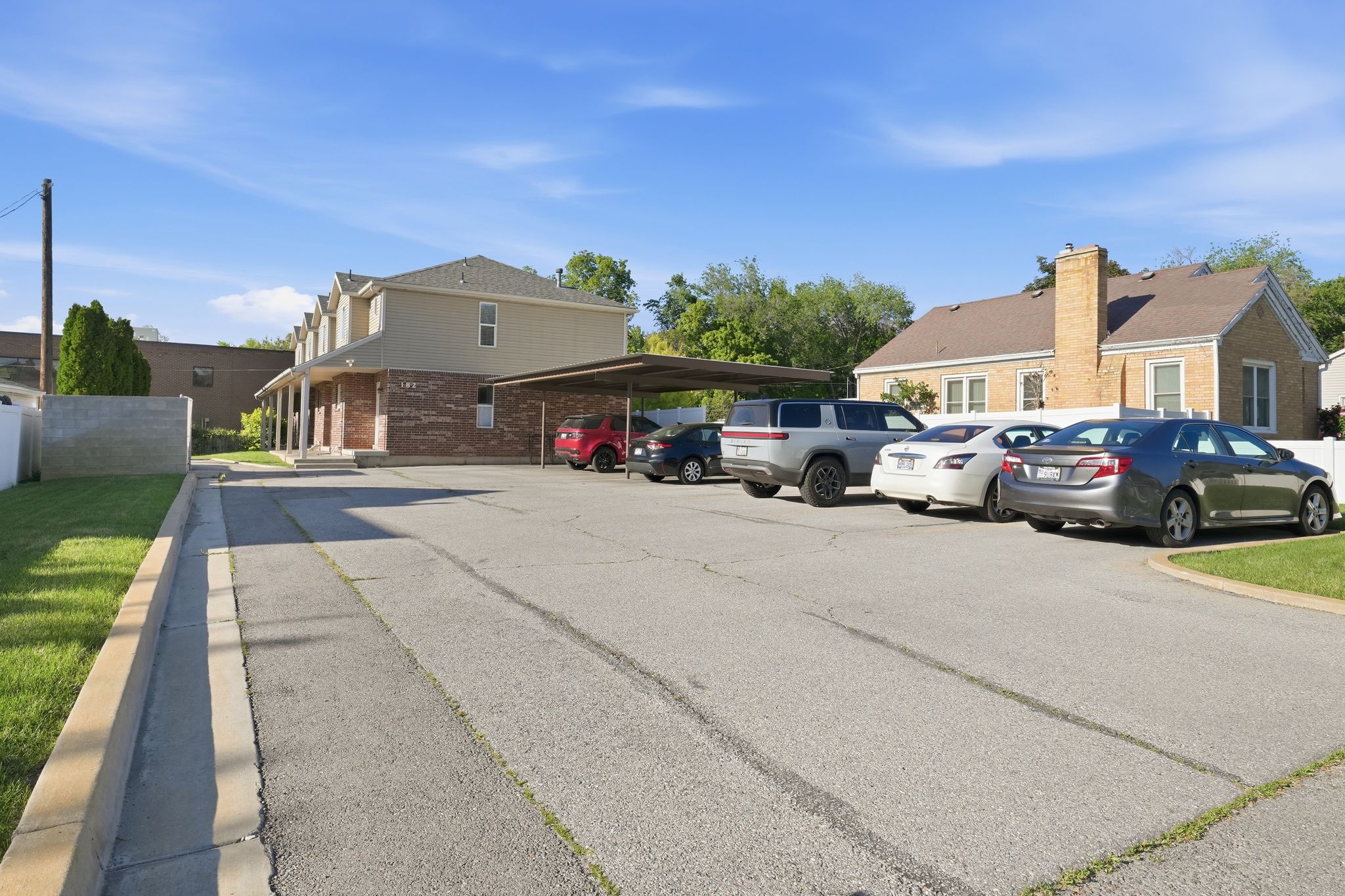 Expansive asphalt parking area with designated spaces