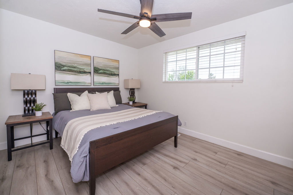 Light wood-finish flooring complements the neutral wall color