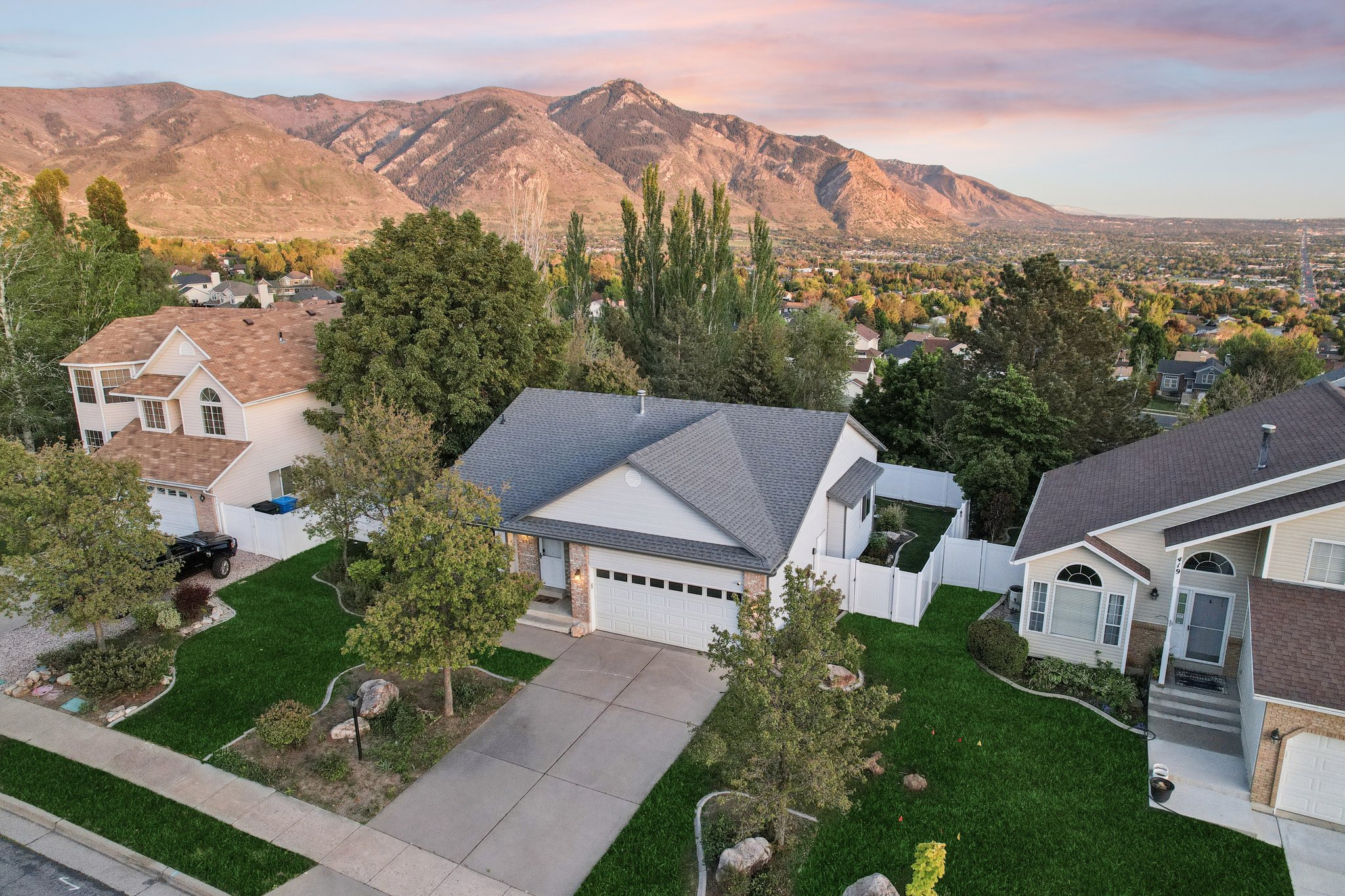 Single-story residence featuring a two-car garage and a pitched roof