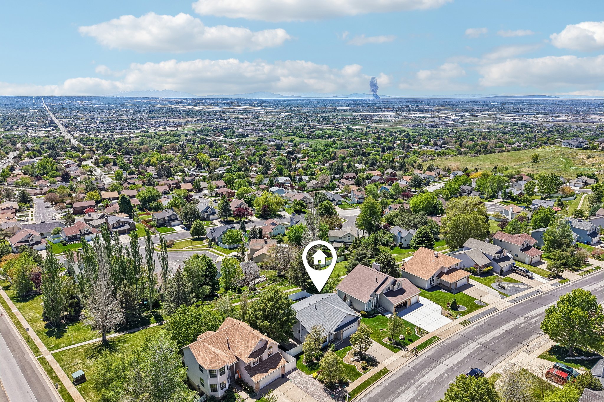 Aerial perspective showcasing a residential neighborhood with a mix of single-story and multi-story homes
