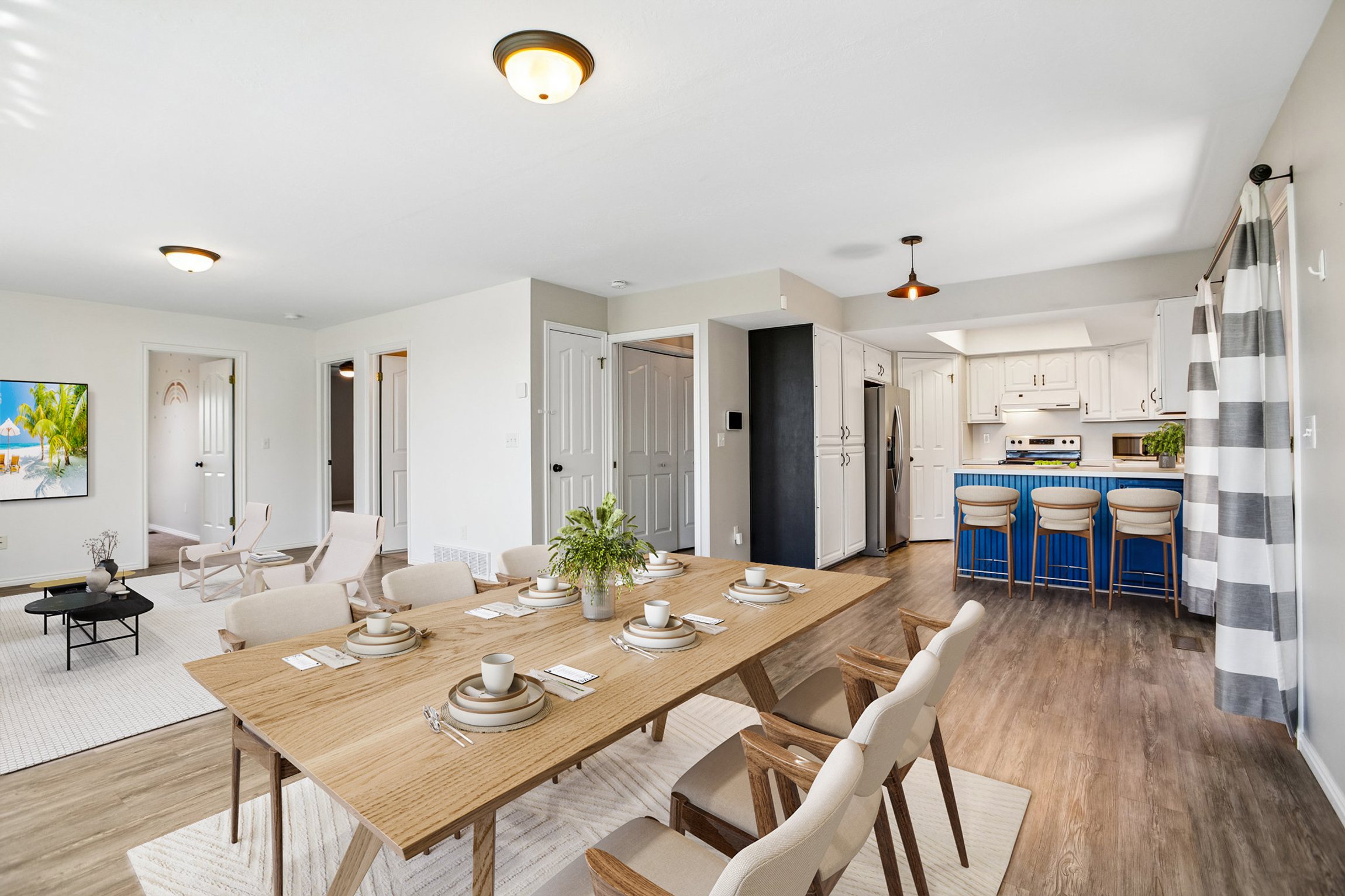 Open-concept dining area featuring wood-finish flooring