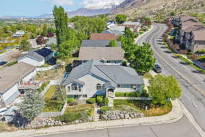 Aerial perspective of suburban area with a mountainous background