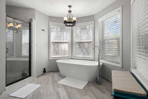 Freestanding soaking tub with floor-mounted faucet
