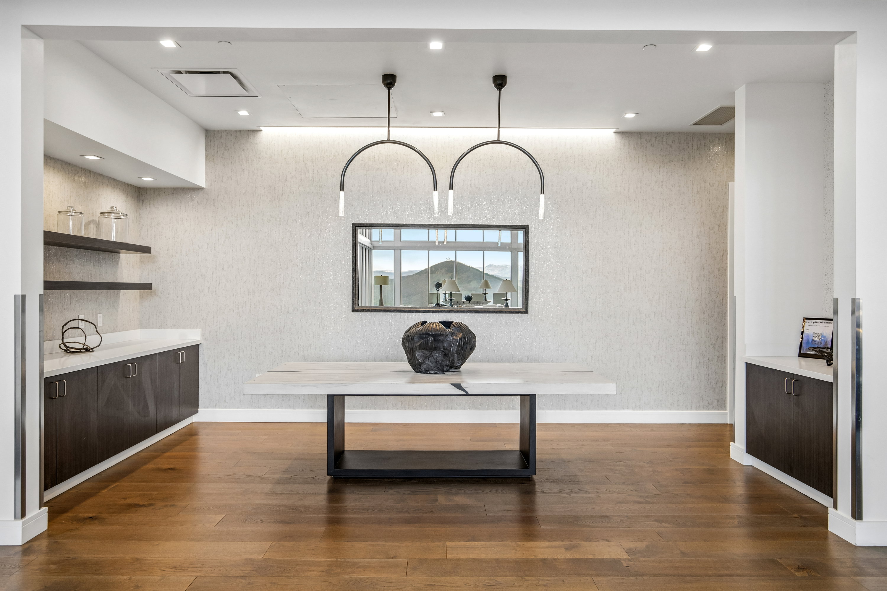 Hardwood flooring complemented by a textured accent wall