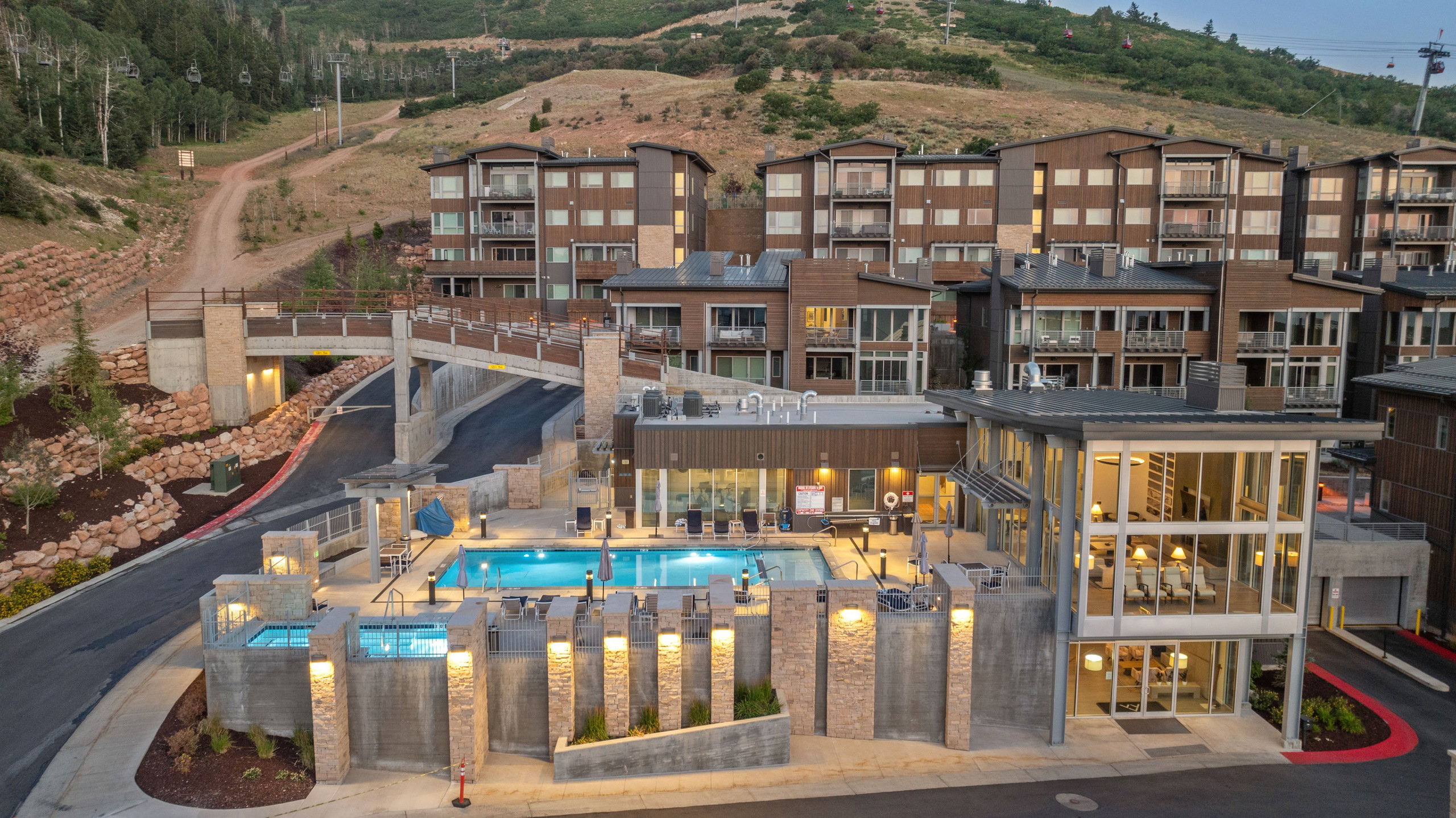 Contemporary multi-story buildings featuring balconies and large windows