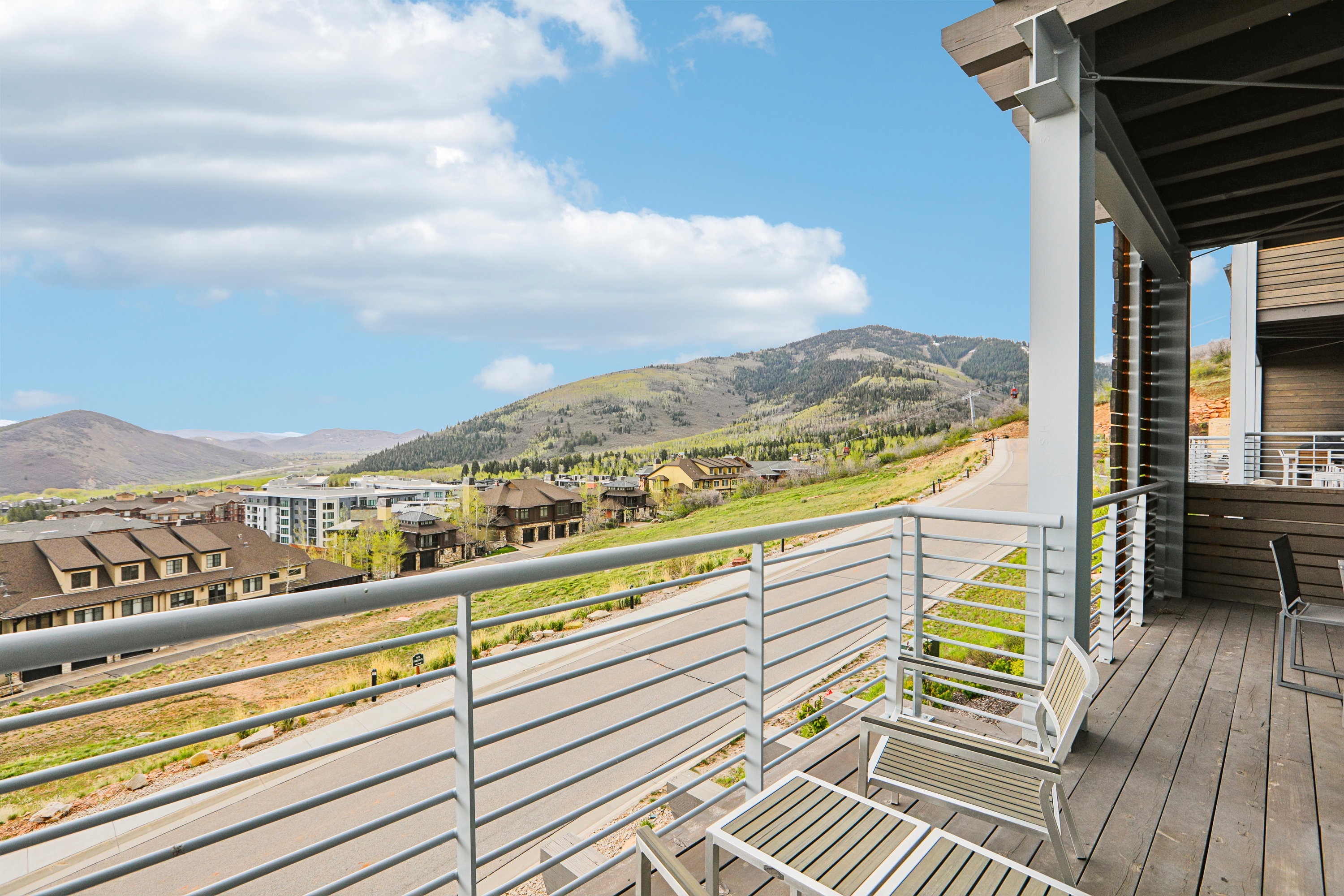Expansive balcony with wood decking and cable railing system