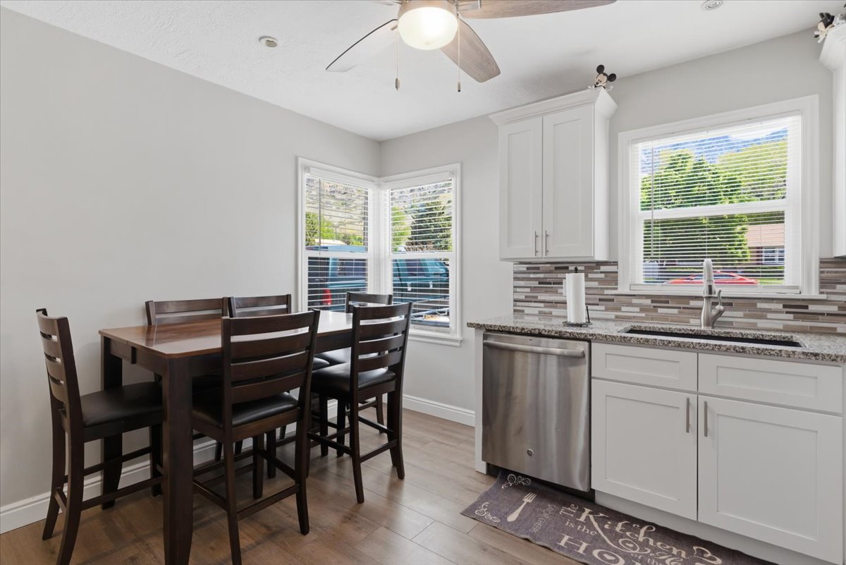 Kitchen and dining area featuring wood-finish flooring