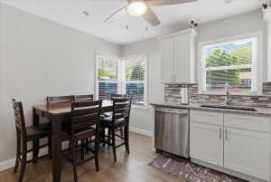 Kitchen and dining area featuring wood-finish flooring