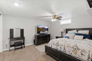 Bedroom featuring neutral carpeting, light-toned walls, and a ceiling fan with integrated lighting