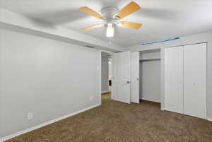 Room featuring wall-to-wall carpeting and neutral wall paint