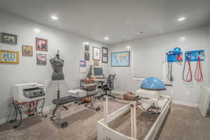 Exercise room with carpet and recessed lighting