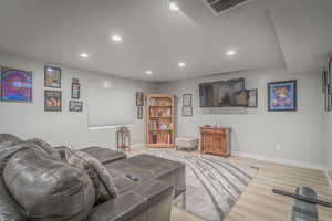 Living room featuring recessed lighting and light wood-type flooring