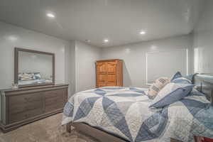 Carpeted bedroom featuring recessed lighting