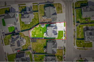 Aerial perspective of suburban area with property boundaries highlighted