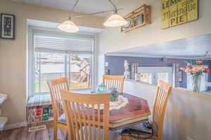 Dining area with wood-finish flooring