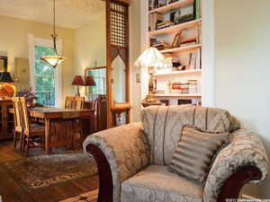 Built-in shelving unit providing storage, recessed lighting, and wood-finish flooring