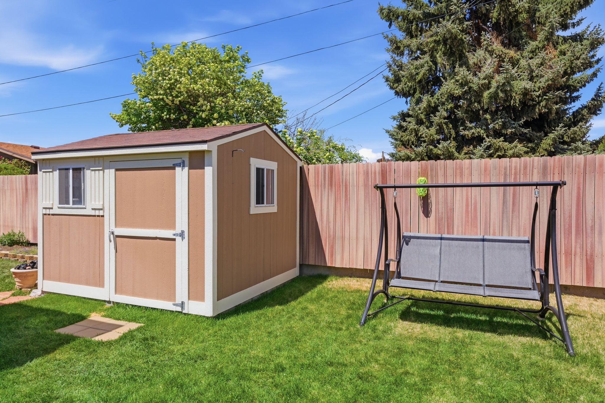 View of shed featuring a fenced backyard