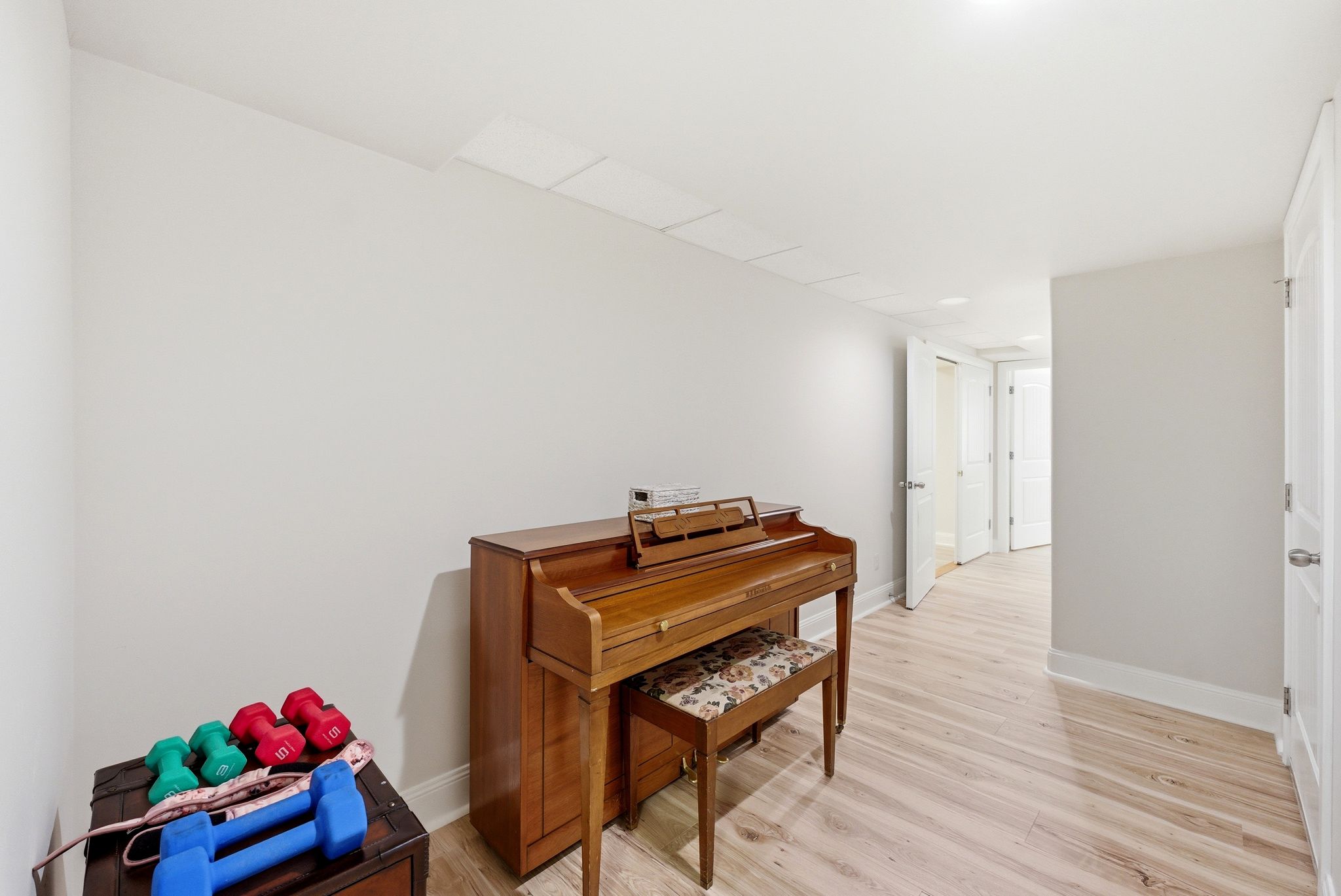 Hall featuring light wood finished floors