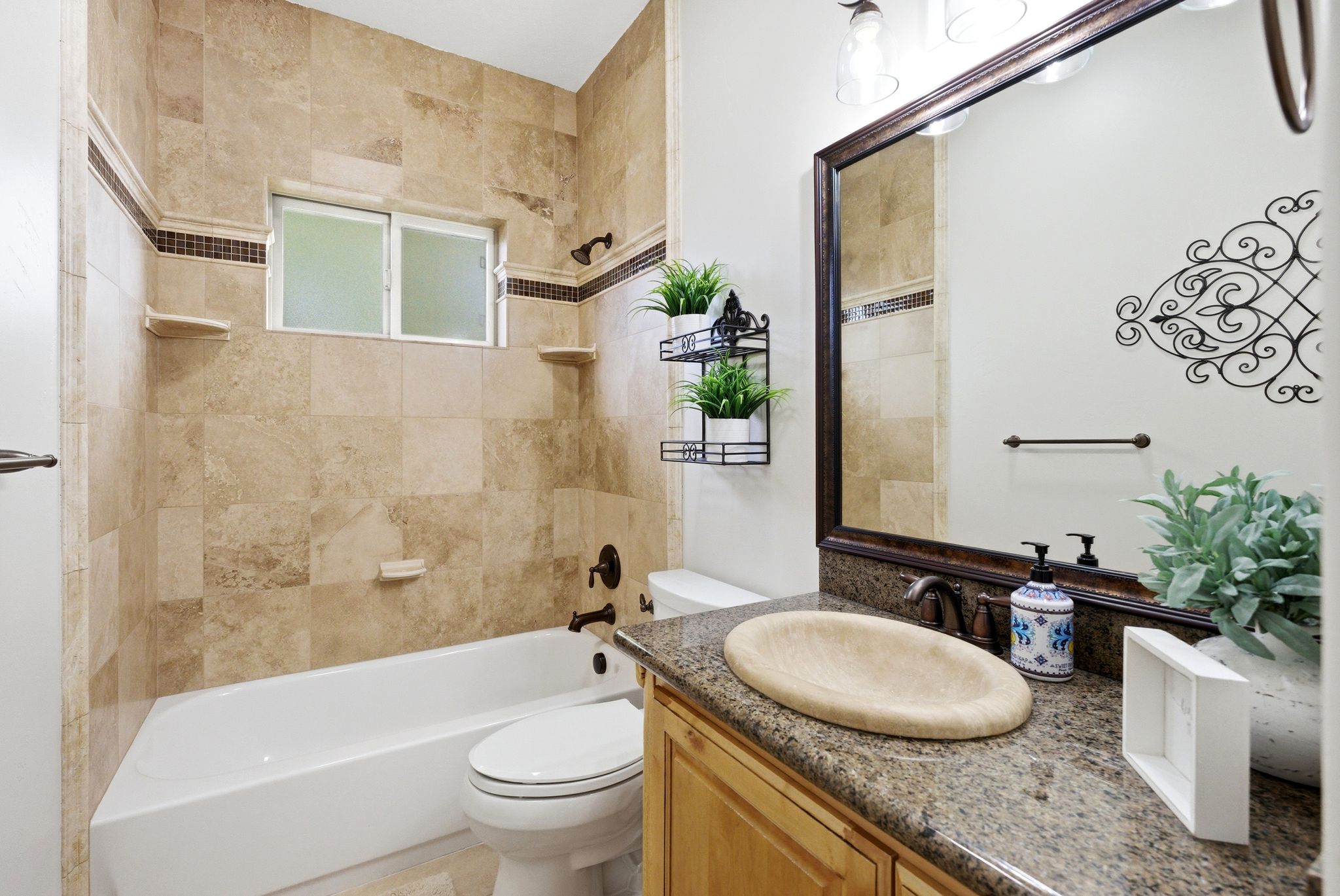 Full bath with vanity and tub / shower combination