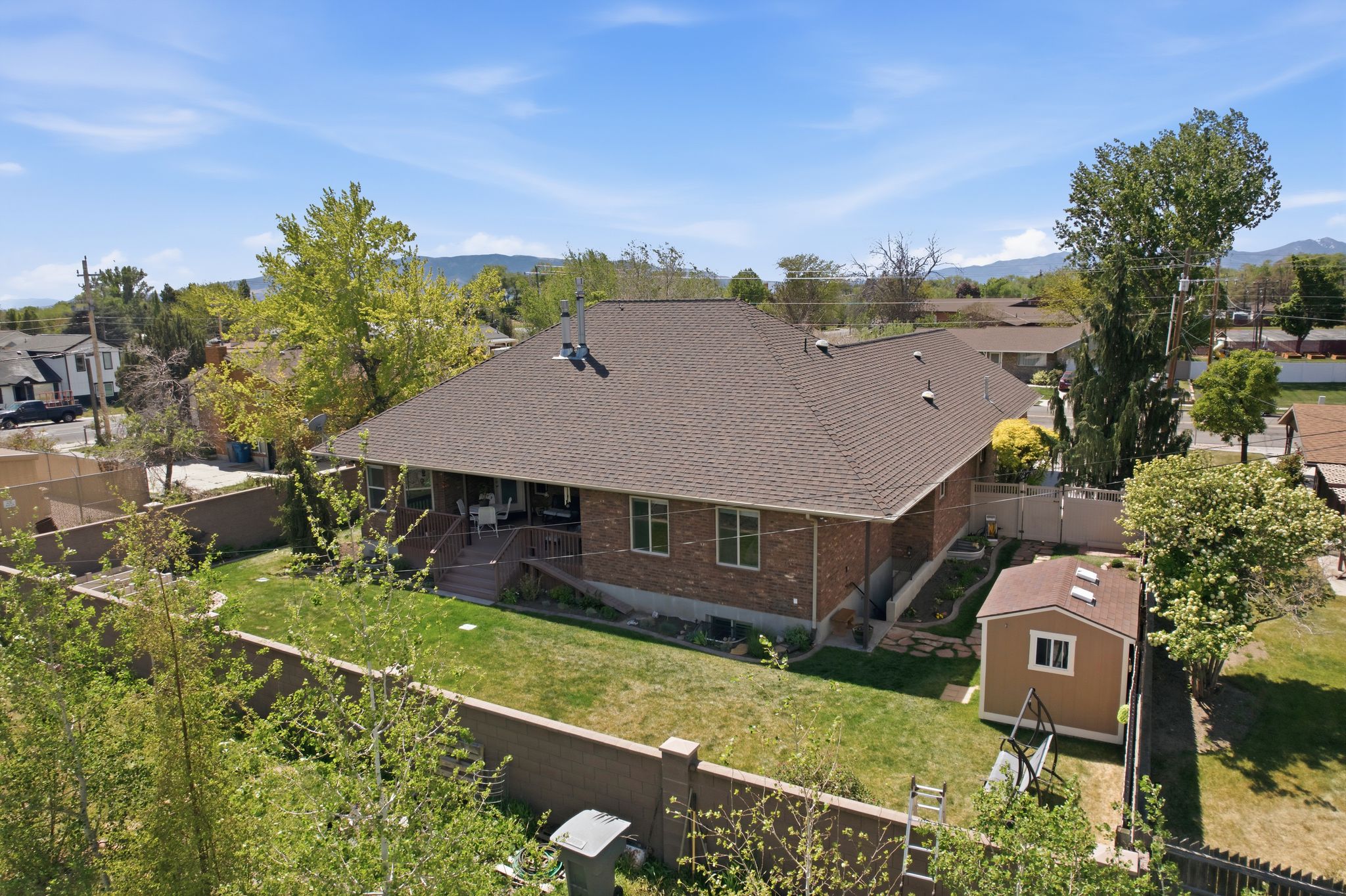 Aerial perspective of suburban area with a mountainous background