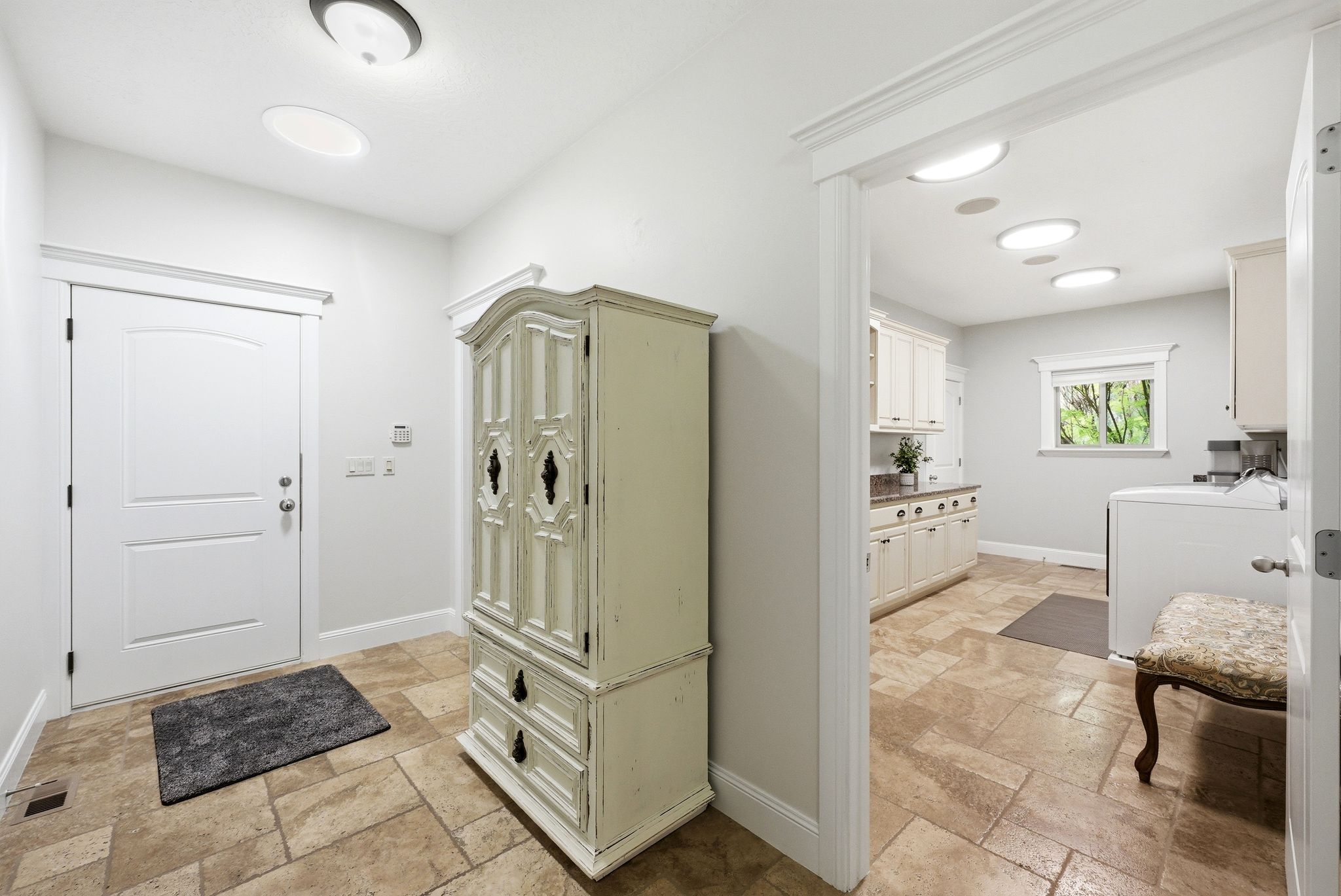 Mudroom with stone tile floors