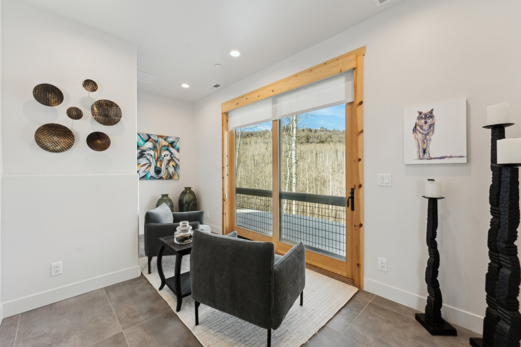 Expansive glass sliding door with natural wood framing