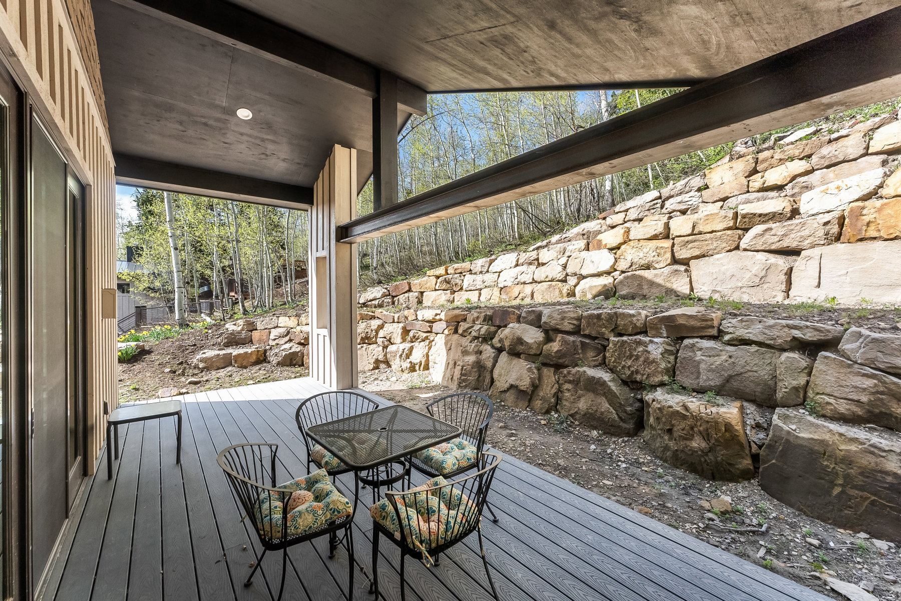 Covered outdoor deck with wood-finish decking