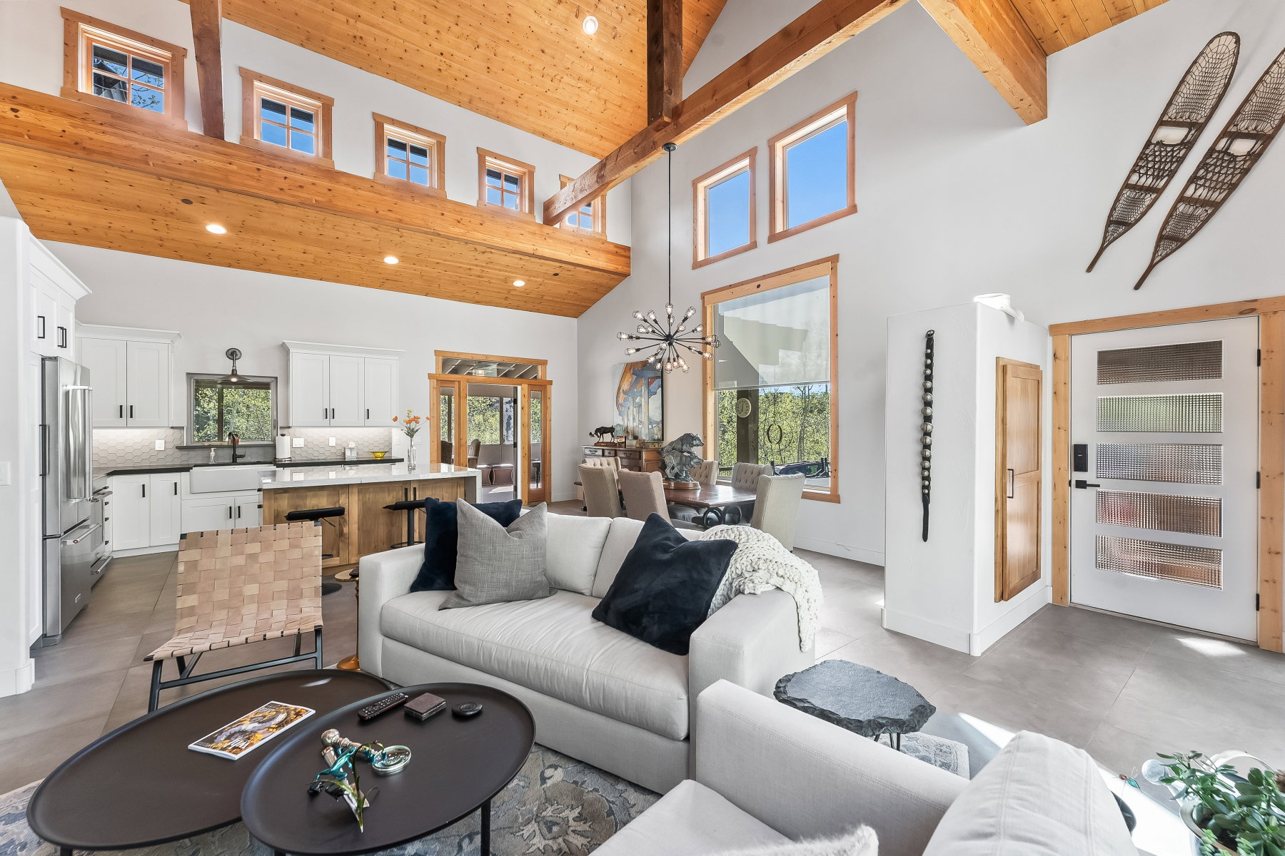 Vaulted wood-finish ceilings with exposed beams and recessed lighting